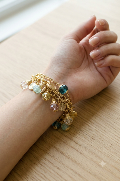 Multicolor charms bracelet for women featuring an assortment of colorful decorative charms on a chain
